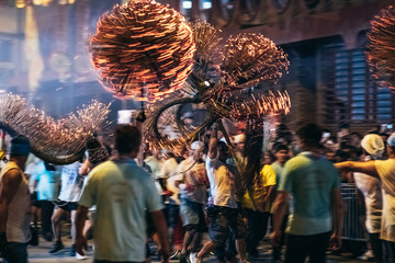 Tai Hang Fire Dragon Dance - People performing the dance by holding the body of the dragon, dragon ball and dance through the street - obrazy, fototapety, plakaty