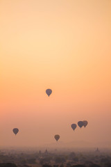 Hot-Air Balloons and Pagodas at misty Old Bagan, Myanmar
