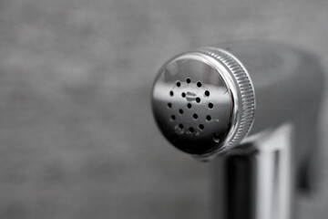 Close Up on a bidet shower head.