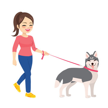 Happy young woman walking with husky dog pet