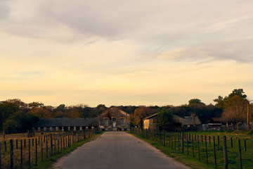 sunset over old rural building