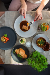 Top view of business lunch - different tasty dishes on the table table from high view angle.