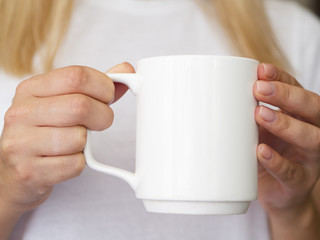 Close-up woman with white mug