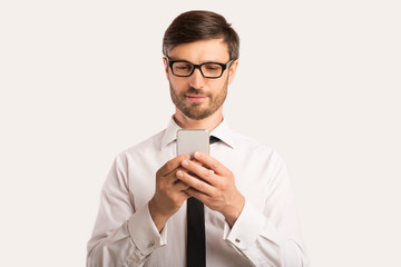Businessman Using Smartphone Standing Over White Background