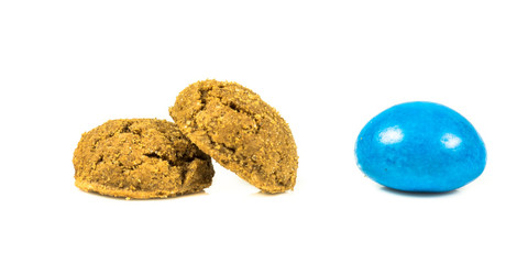 Row of colorful Pepernoten traditional dutch treats on white background