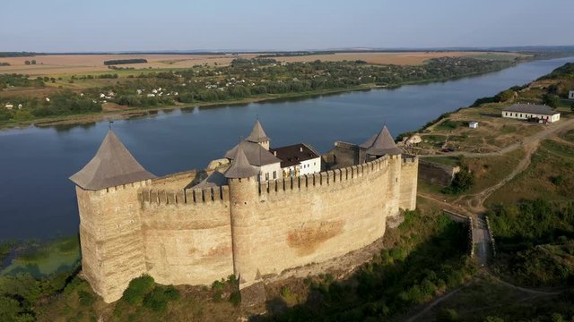 Aerial view of old castle near the River. Hotyn Castle in Ukraine. Eastern Europe. Beautiful panorama from right to left.