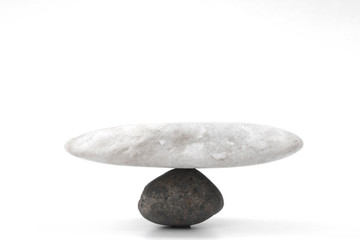 A picture of a rock standing together showing a balance on a white background.