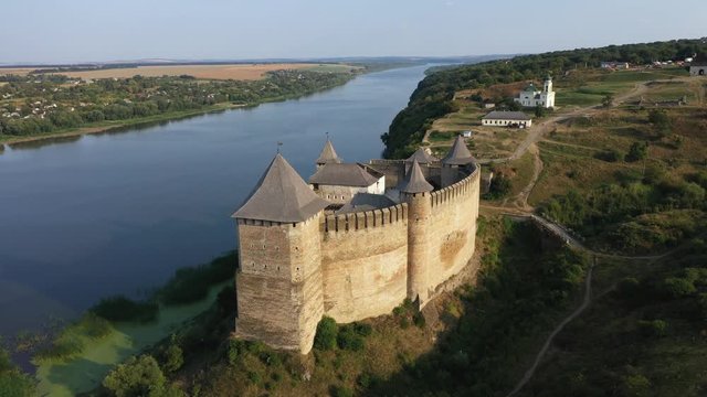 Aerial view of old castle near the River. Hotyn Castle in Ukraine. Eastern Europe. Beautiful panorama from right to left.