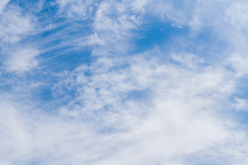 White fluffy clouds in the blue sky in summer