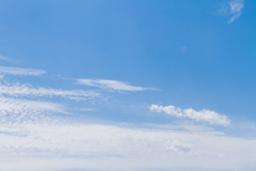 Naklejka na ściany i meble White fluffy clouds in the blue sky in summer