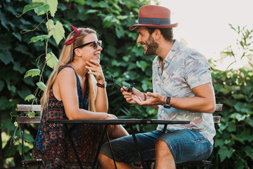 Obraz na płótnie Canvas Couple in love enjoying on the beautiful terrace flirting and smiling