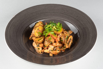 Chicken stew with chicken fillet, beans, champignons, potato and bell pepper isolated on white