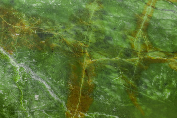 Green natural marble with brown veins in cracks, texture for ceramic tiles and floor tiles