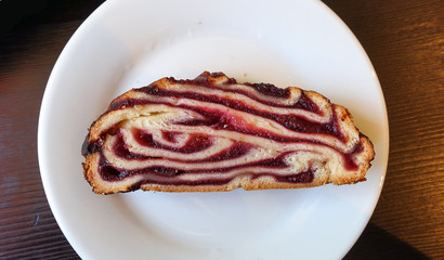 Homemade baking. Sliced cupcake on a plate. Stuffed pastries