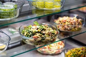 Variety of salad in restaurant shelf 