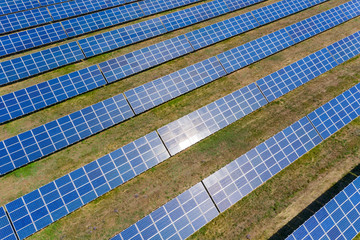 Aerial view of many panels of solar cells.