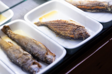 Prepared fish and seafood in shelf of restaurant 