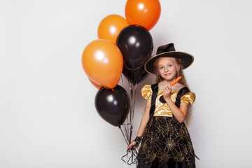 Pretty girl in Halloween witch costume