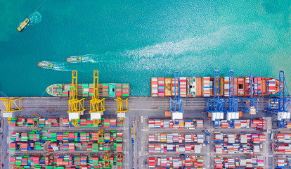 Top view of Deep water port with cargo ship and containers. It is an import and export cargo port where is a part of shipping dock and export products worldwide