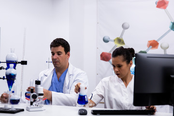 Team of researchers wearing their coat in research laboratory