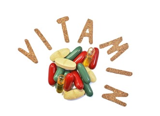Vitamin capsules on a white background. Vitamin B, C, zinc, iron, fish oil.
