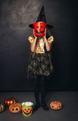 Girl with candy bucket used as mask
