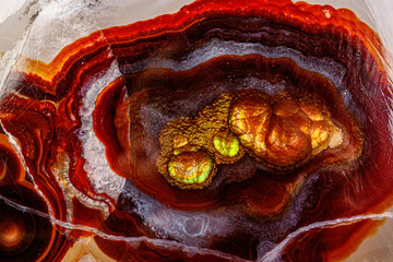 macro mineral stone fire agate on a black background