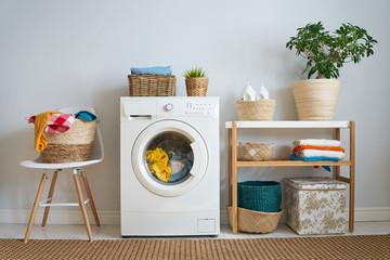 laundry room with a washing machine - obrazy, fototapety, plakaty