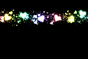 Gradient hearts on black background. Valentine's Day abstract background with hearts