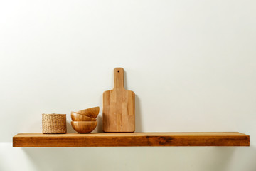 Wooden kitchen shelf of free space for your decoration and gray wall space 