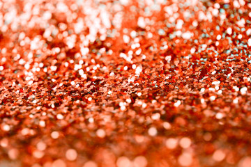 Red glitter shine dots confetti. Abstract light blink sparkle defocus backgound.