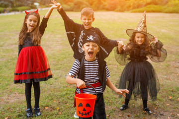 Little pirate trick or treating with friends