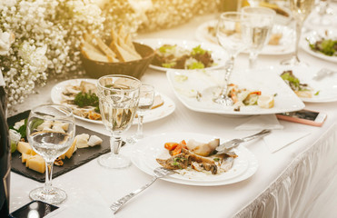 Empty dish with fork and spoon on background