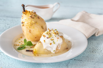 Poached pears on the white plate