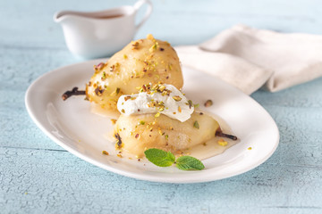 Poached pears on the white plate
