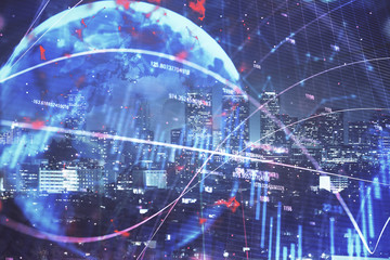 Obraz premium Financial graph on night city scape with tall buildings background multi exposure. Analysis concept.