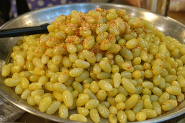 Pickle sour grape, Thai style pickle fruit snack serve by mix with ground chilli, salt and sugar