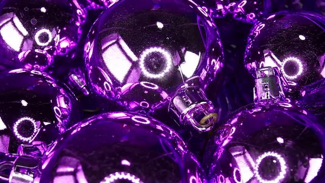 Purple christmas ball ornaments balls bauble baubles footage video on slow motion rotating rolling plate
