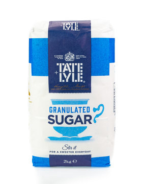 Bag of Tate and Lyle granulated sugar. White background.