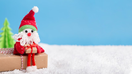 Small toy with New year presents waiting for congratulations