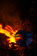 disk ( SD) is burning in the flames of a fire. the concept of combustion disk data corruption