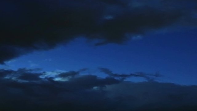 Timelapse of the dark clouds moving in the evening