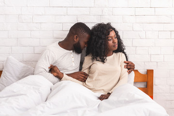 Young black woman refusing to have sex with her husband