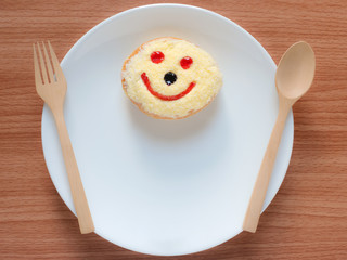 Smiley face, A smiley donut on a plate, white background