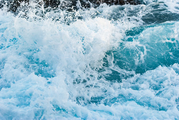 Raging waves foam of the Atlantic Ocean