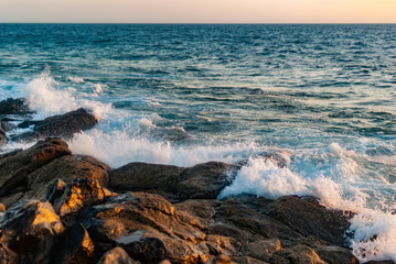 waves cover a stone coast