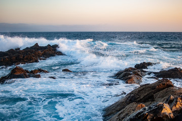 waves breaking on stone reef atlantic ocean