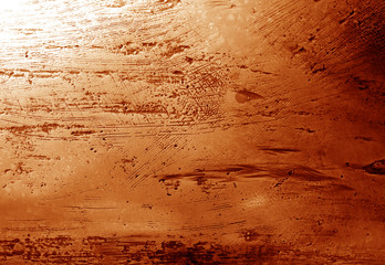 Metal rough surface in orange tone.