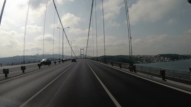 Driving on Bosphorus Bridge in Istambul tat is connecting Europe and Asia