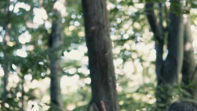 Men workers moving wood for construction of forest sheed